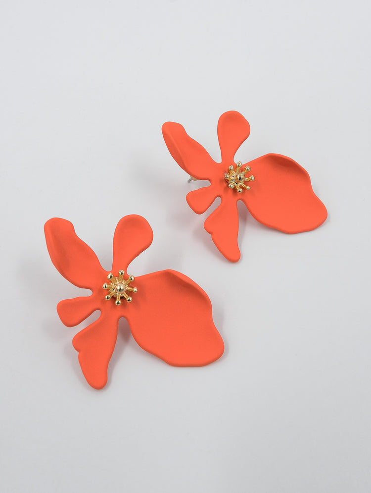 orange flower earrings with gold centre that look like stamen