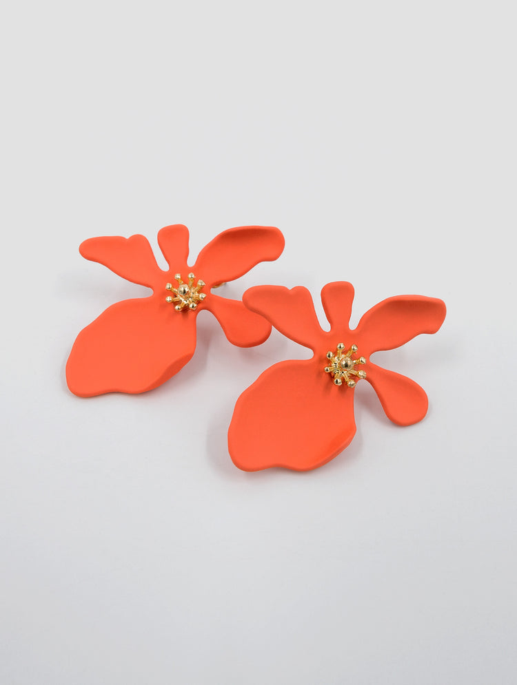 orange flower earrings with gold centre that look like stamen